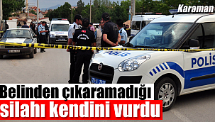 Belinden çıkaramadığı silahı kendini vurdu
