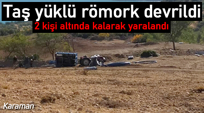 Devrilen taş yüklü römorkun altında kaldılar