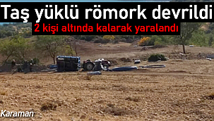 Devrilen taş yüklü römorkun altında kaldılar